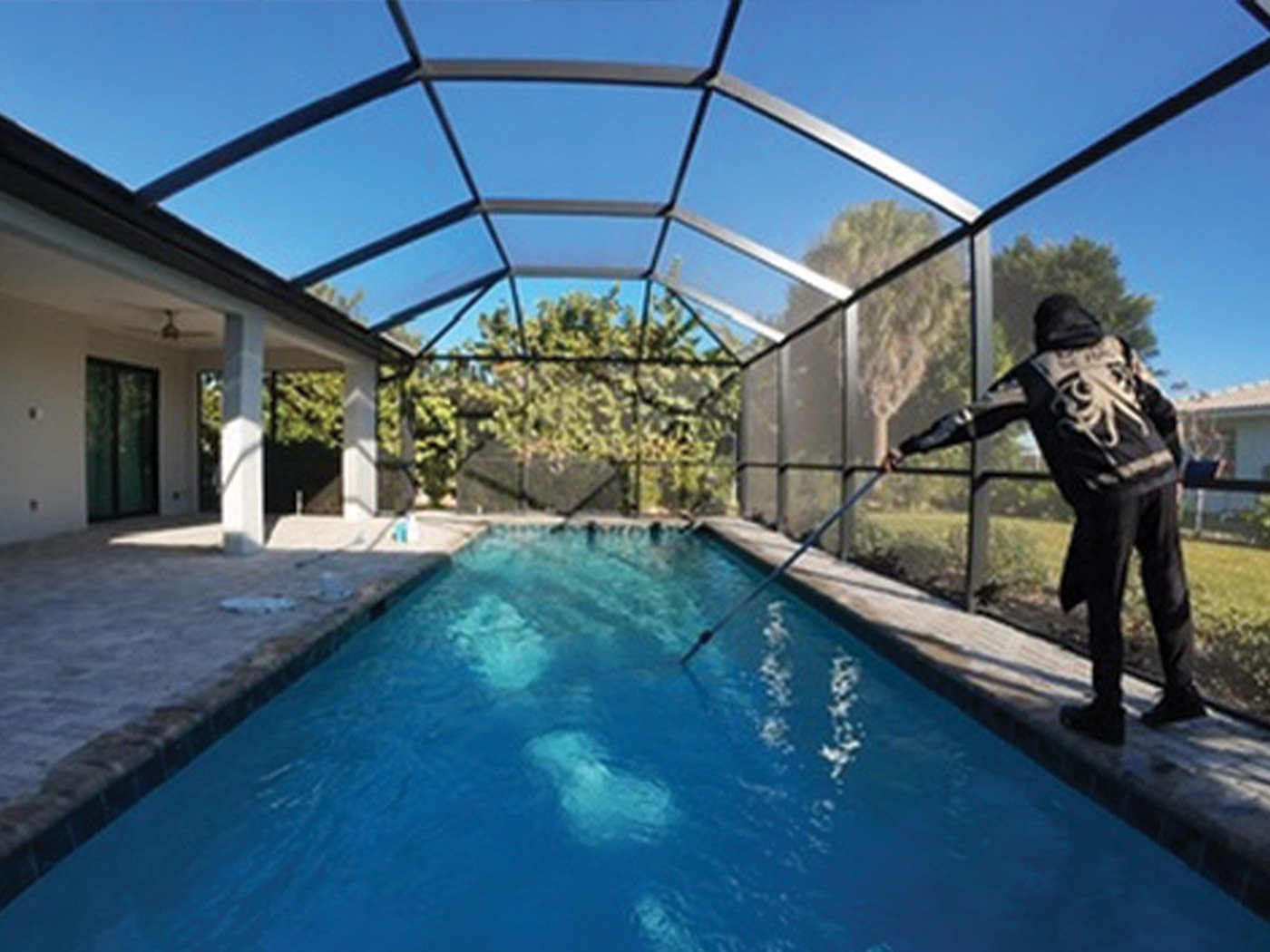 Technician servicing pool equipment